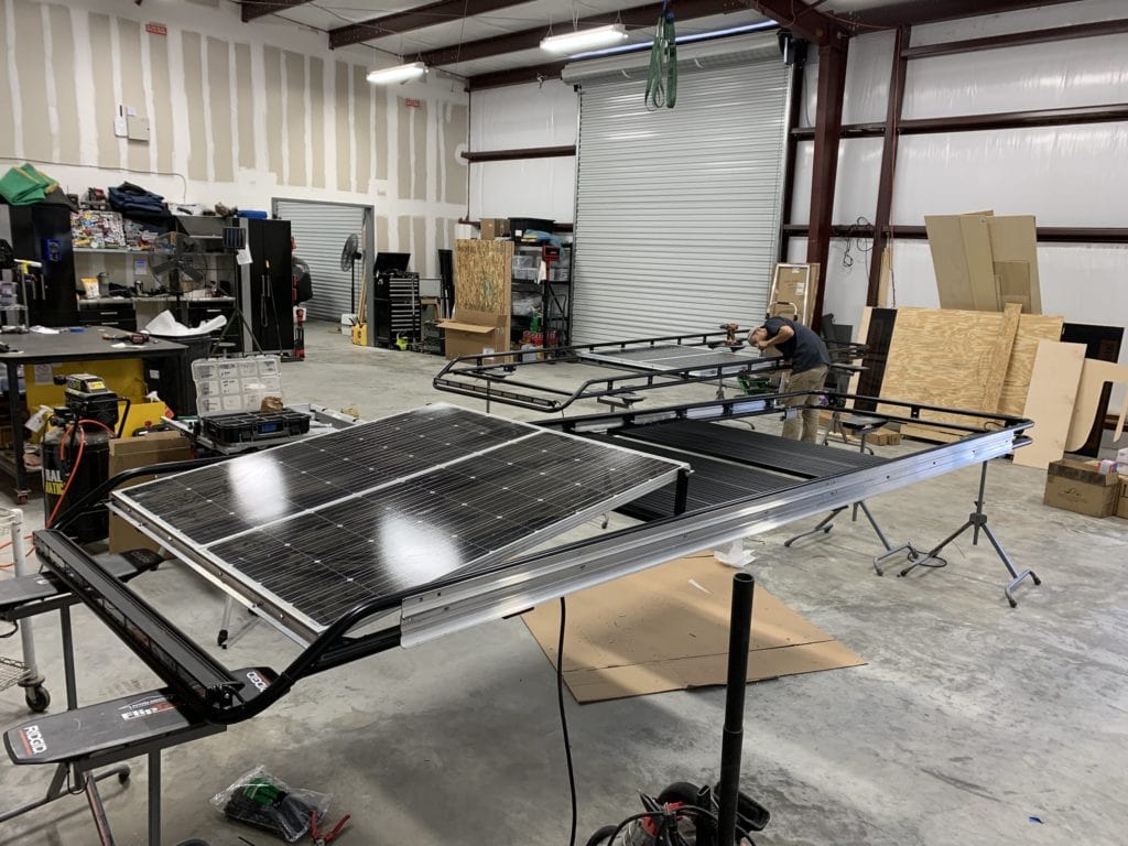 roof racks in warehouse being constructed prior to installation on van